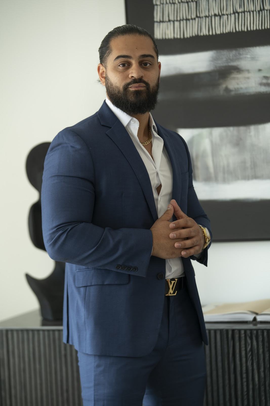 Roberto Green, Jr. in a navy suit