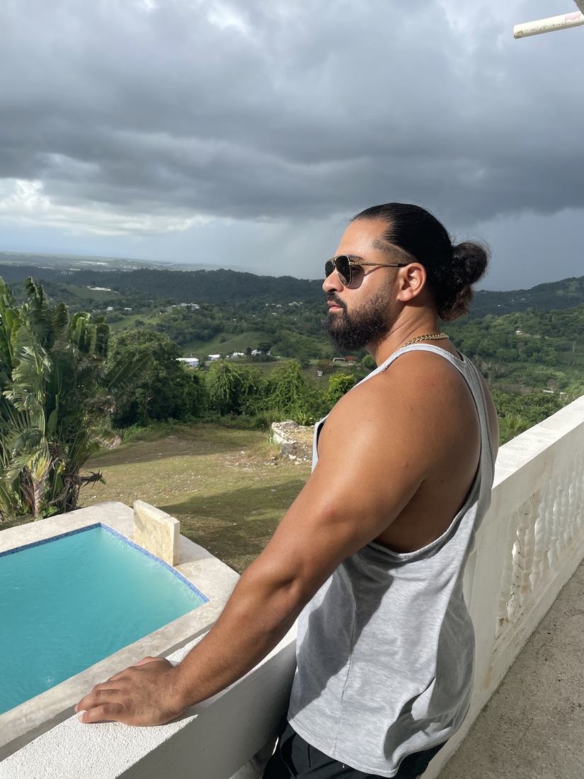 Roberto on a villa balcony overlooking the Puerto Rico hills