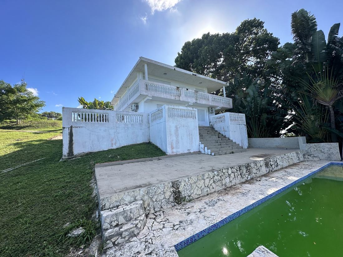 The property before renovation, with an unused pool