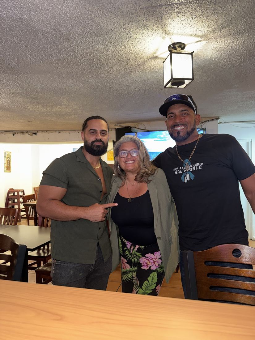 Victor Rosario, on the right in a cap, with two others