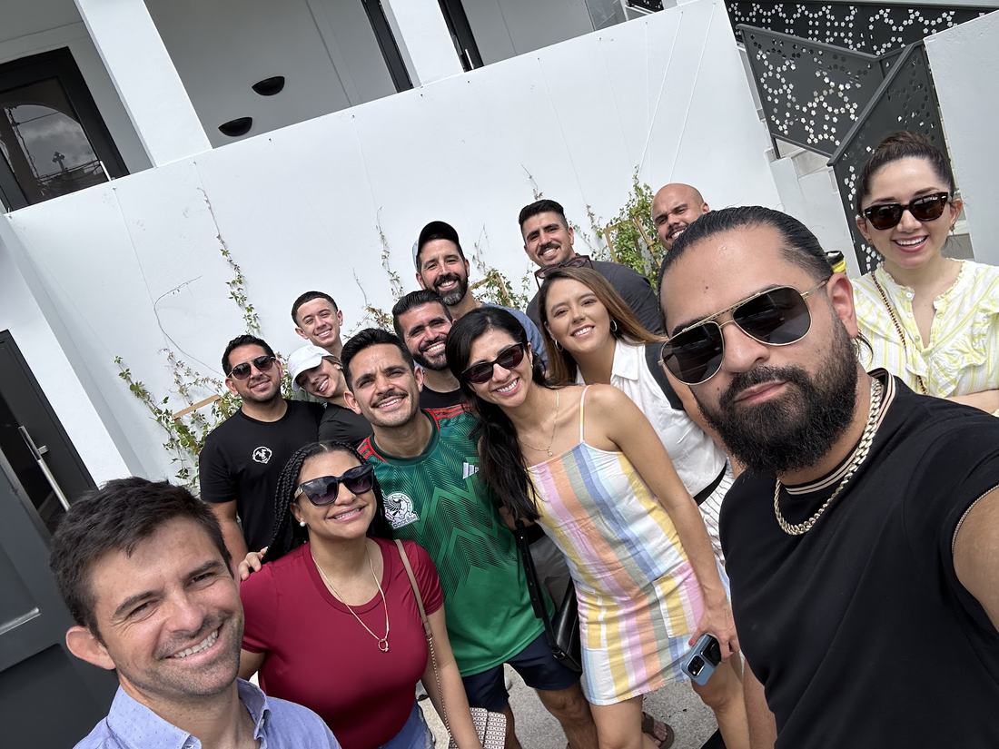 Roberto with a group of guests outside a villa
