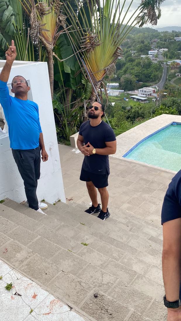 Roberto walking a villa property with a student