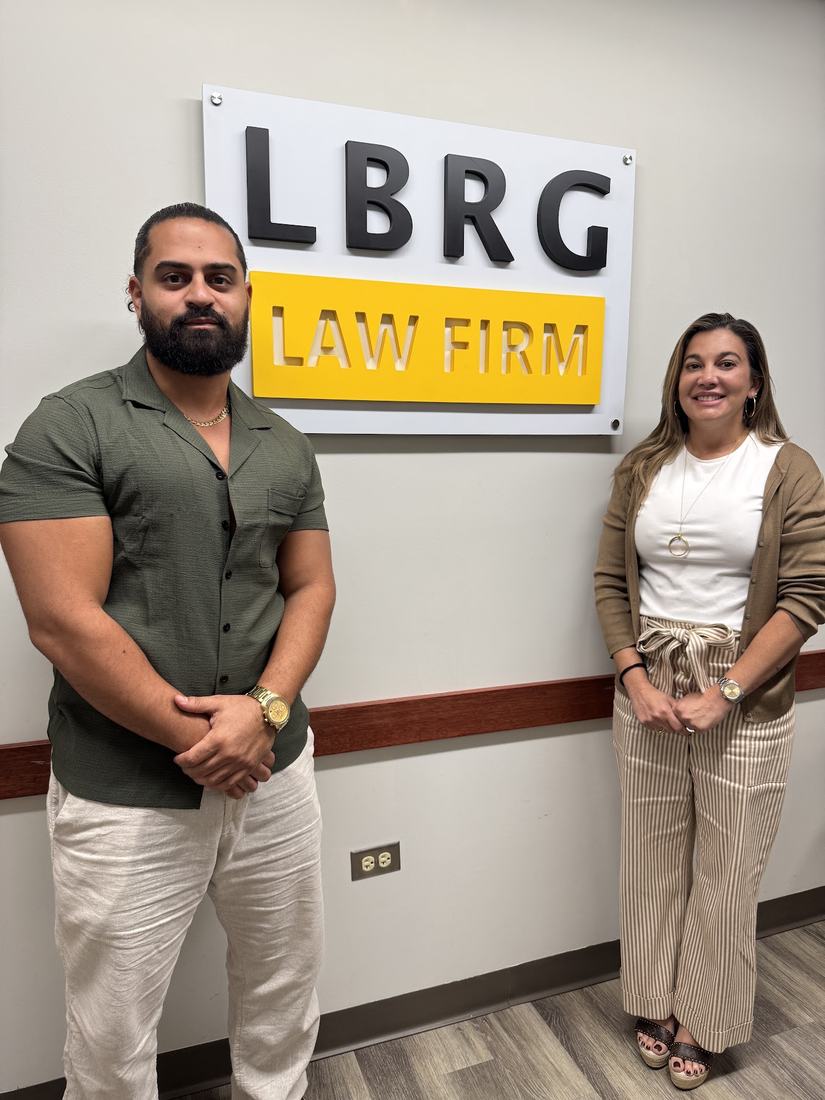 Roberto with a student at a law firm on closing day